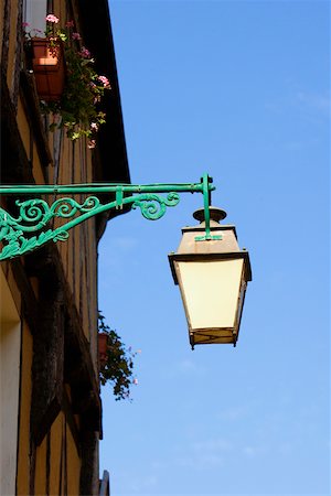 Low angle view of a lantern mounted on the wall, Le Mans, Sarthe, Pays-de-la-Loire, France Stock Photo - Premium Royalty-Free, Code: 625-02927615
