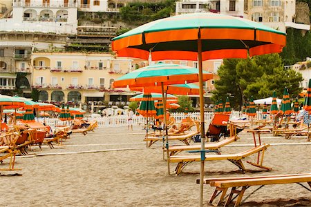 simsearch:625-02928686,k - Lounge chairs with beach umbrellas on the beach, Spiaggia Grande, Positano, Amalfi Coast, Salerno, Campania, Italy Stock Photo - Premium Royalty-Free, Code: 625-02927823