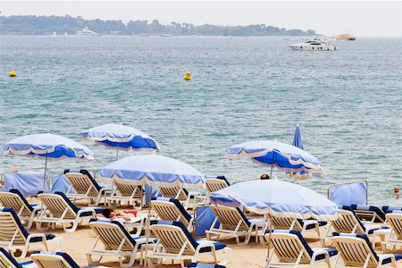 simsearch:625-02928282,k - Lounge chairs and beach umbrellas on the beach, Plage De La Croisette, Cote d'Azur, Cannes, Provence-Alpes-Cote D'Azur, France Stock Photo - Premium Royalty-Free, Code: 625-02927867