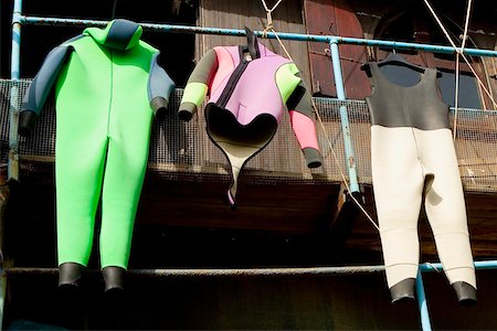 Wetsuits hanging on a pipe, Cinque Terre National Park, RioMaggiore, Cinque Terre, La Spezia, Liguria, Italy Foto de stock - Sin royalties Premium, Código: 625-02927955