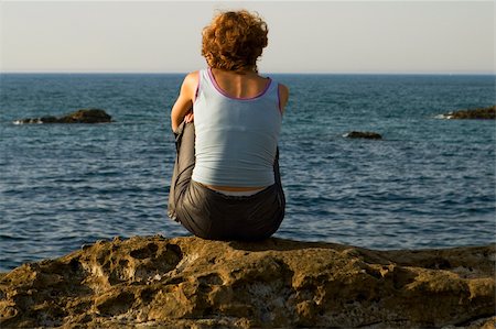 simsearch:625-02928309,k - Rear view of a woman sitting on a rock, Baie De Biarritz, Biarritz, Pyrenees-Atlantiques, France Stock Photo - Premium Royalty-Free, Code: 625-02928031