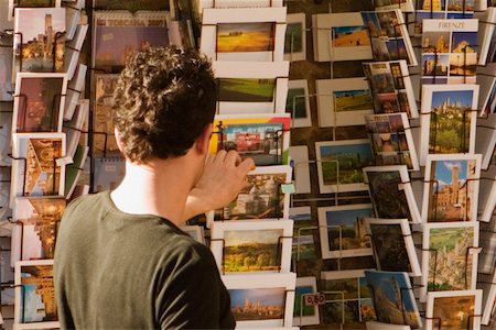 simsearch:625-02928679,k - Rear view of a man choosing postcards, Piazza Della Cisterna, San Gimignano, Siena Province, Tuscany, Italy Stock Photo - Premium Royalty-Free, Code: 625-02928176