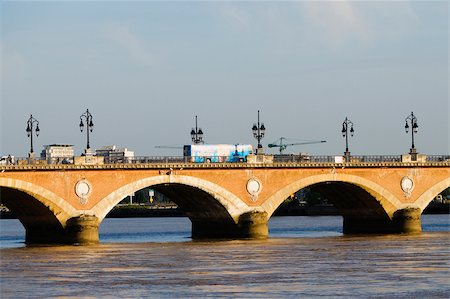 river bus - Arch bridge across a river, Pont De Pierre, Garonne River, Bordeaux, Aquitaine, France Stock Photo - Premium Royalty-Free, Code: 625-02928263