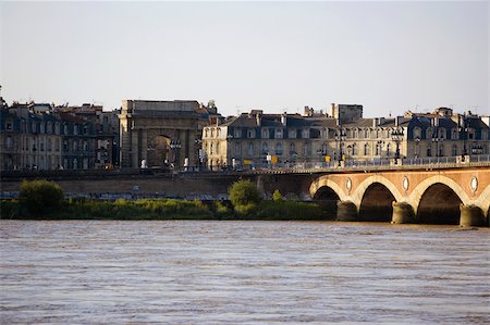 Arch bridge across a river, Pont De Pierre, Porte De Bourgogne, Garonne River, Bordeaux, Aquitaine, France Stock Photo - Premium Royalty-Free, Code: 625-02928315