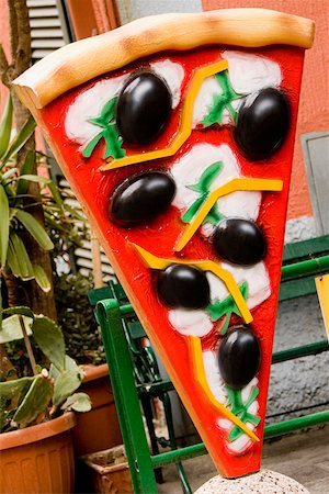 Pizza sculpture in front of a restaurant, Parco Nazionale delle Cinque Terre, Manarola, La Spezia, Italy Stock Photo - Premium Royalty-Free, Code: 625-02928347