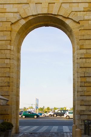 Traffic on road viewed through an arch, Porte de la Monnaie, Vieux Bordeaux, Bordeaux, France Stock Photo - Premium Royalty-Free, Code: 625-02928402