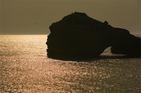 simsearch:625-02928501,k - Silhouette of rock formations in the sea, Biarritz, France Stock Photo - Premium Royalty-Free, Code: 625-02928548