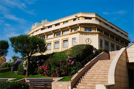 Low angle view of a formal garden in front of a building, Biarritz, Pyrenees-Atlantiques, Aquitaine, France Stock Photo - Premium Royalty-Free, Code: 625-02928673