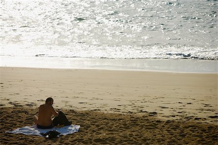 simsearch:625-02928658,k - Rear view of a man sitting on the beach, Grande Plage, Biarritz, France Stock Photo - Premium Royalty-Free, Code: 625-02928803
