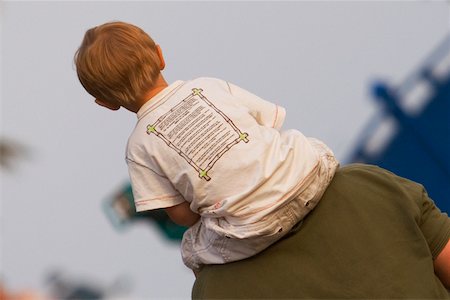 father carrying son on shoulder - Rear view of a man carrying his son on shoulders, Nice, Provence-Alpes-Cote D'Azur, France Stock Photo - Premium Royalty-Free, Code: 625-02928924