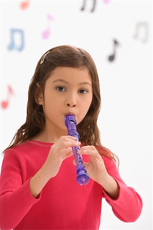 flûte (instrument) - Portrait d'une jeune fille jouant d'une flûte en classe Photographie de stock - Premium Libres de Droits, Code: 625-02928965