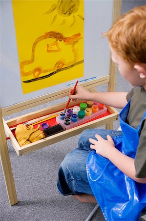 High angle view of a schoolboy painting in an art class Stock Photo - Premium Royalty-Free, Code: 625-02928973