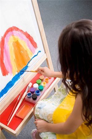 High angle view of a schoolgirl painting in an art class Stock Photo - Premium Royalty-Free, Code: 625-02928993