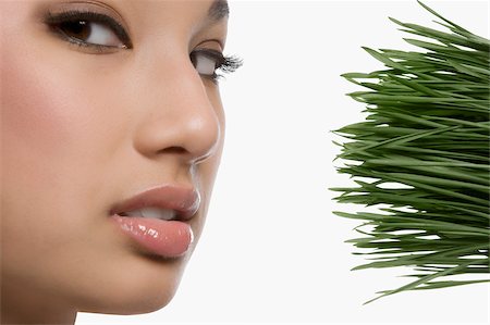 simsearch:625-02267557,k - Close-up of a young woman with wheatgrass Stock Photo - Premium Royalty-Free, Code: 625-02929004