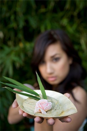 depressed young indian woman - Close-up of a young woman holding a bowl of herb Stock Photo - Premium Royalty-Free, Code: 625-02929011