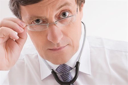 depression man - Close-up of a male doctor looking worried Foto de stock - Sin royalties Premium, Código: 625-02929182