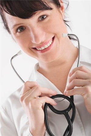 simsearch:625-02929220,k - Portrait of a female doctor holding a stethoscope Stock Photo - Premium Royalty-Free, Code: 625-02929191