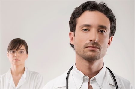simsearch:625-02929220,k - Close-up of a male doctor with a female doctor behind him Stock Photo - Premium Royalty-Free, Code: 625-02929233