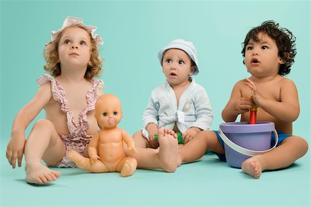 simsearch:625-01093217,k - Three children playing with toys Fotografie stock - Premium Royalty-Free, Codice: 625-02929316