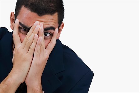 Portrait of a businessman covering his face with his hands Stock Photo - Premium Royalty-Free, Code: 625-02929391