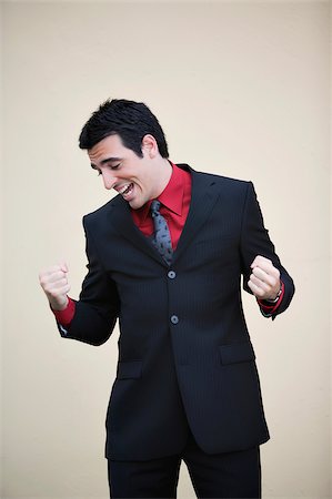 simsearch:625-02930851,k - Businessman making a fist and smiling Stock Photo - Premium Royalty-Free, Code: 625-02929430