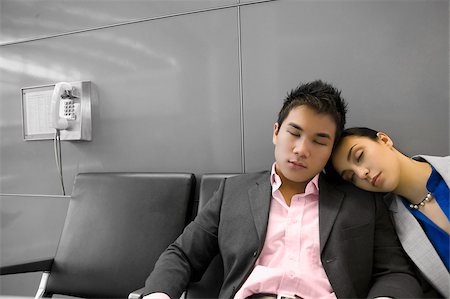 public transportation sleep - Businessman and a businessman sleeping in the waiting room Stock Photo - Premium Royalty-Free, Code: 625-02929591
