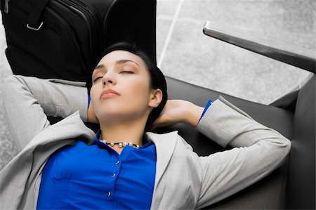 simsearch:625-02932995,k - High angle view of a businesswoman sleeping Stock Photo - Premium Royalty-Free, Code: 625-02929593