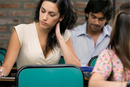 pondering in a university classroom - University students in a classroom Stock Photo - Premium Royalty-Free, Code: 625-02929684
