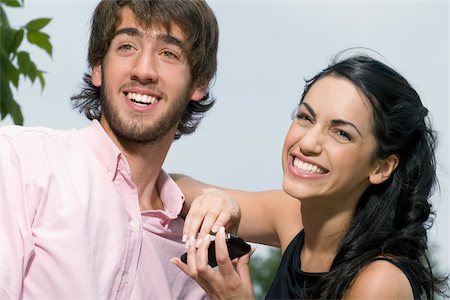 simsearch:625-02929666,k - Close-up of a young couple smiling Stock Photo - Premium Royalty-Free, Code: 625-02929720