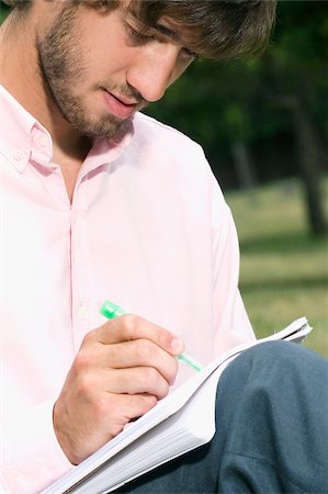 simsearch:625-02929760,k - Close-up of a young man writing with a pen in a notepad Stock Photo - Premium Royalty-Free, Code: 625-02929753