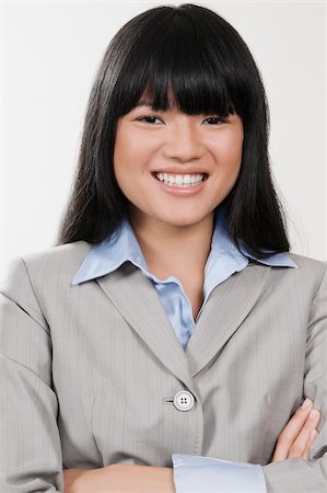 simsearch:625-02930848,k - Portrait of a businesswoman smiling Fotografie stock - Premium Royalty-Free, Codice: 625-02930040