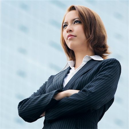 female real estate agent - Close-up of a businesswoman thinking Stock Photo - Premium Royalty-Free, Code: 625-02930053