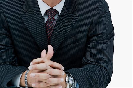 simsearch:640-01359139,k - Mid section view of a businessman with his hands clasped Foto de stock - Sin royalties Premium, Código: 625-02930135