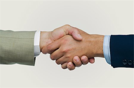 Close-up of two businessmen shaking hands Foto de stock - Sin royalties Premium, Código: 625-02930138