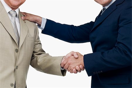Close-up of two businessmen shaking hands Stock Photo - Premium Royalty-Free, Code: 625-02930143