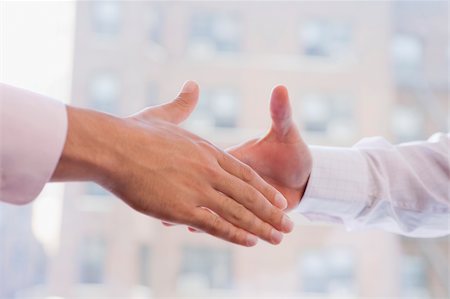 shaking - Close-up of two businessmen shaking hands Stock Photo - Premium Royalty-Free, Code: 625-02930172