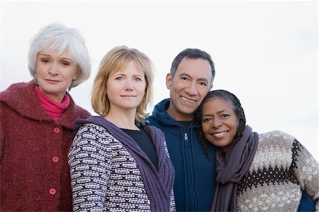 diverse group of friends - Portrait of four friends smiling Stock Photo - Premium Royalty-Free, Code: 625-02930255