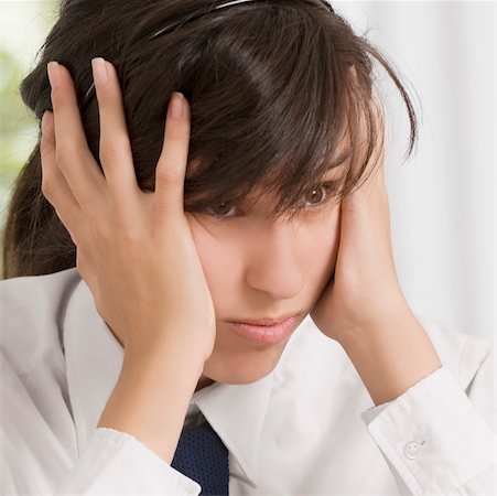 sad kids school uniform - Close-up of a teenage girl with her head in her hands Stock Photo - Premium Royalty-Free, Code: 625-02930317