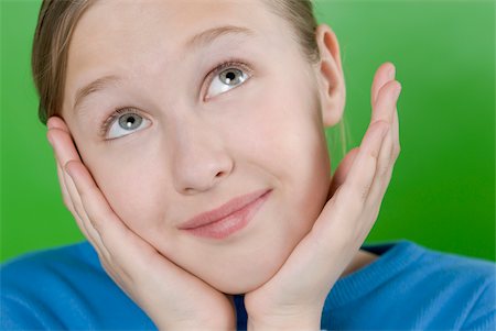 positive ideas - Close-up of a girl with her head in her hands and thinking Stock Photo - Premium Royalty-Free, Code: 625-02930368