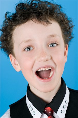 Close-up of a boy with his open mouth Stock Photo - Premium Royalty-Free, Code: 625-02930403