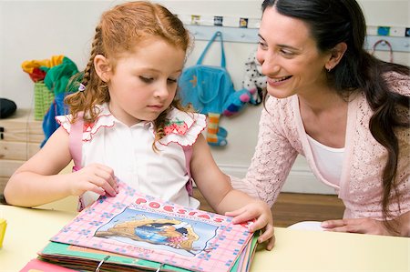 Female teacher teaching her student in a classroom Stock Photo - Premium Royalty-Free, Code: 625-02930513
