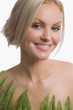 simsearch:625-02930713,k - Portrait of a young woman smiling Stock Photo - Premium Royalty-Free, Code: 625-02930677