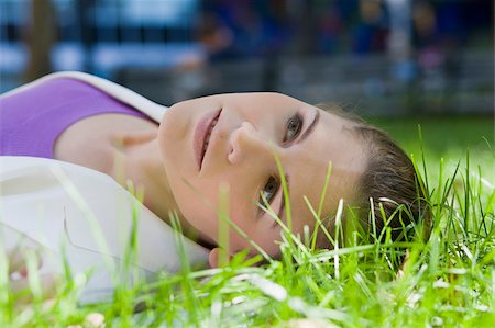 simsearch:625-02932995,k - Businesswoman lying on grass in a park Stock Photo - Premium Royalty-Free, Code: 625-02930814