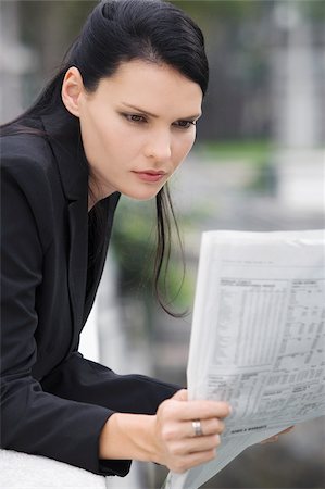 simsearch:625-02932995,k - Close-up of a businesswoman reading a newspaper Stock Photo - Premium Royalty-Free, Code: 625-02930850