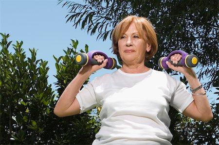 simsearch:625-02932391,k - Senior woman exercising with dumbbells Stock Photo - Premium Royalty-Free, Code: 625-02931005