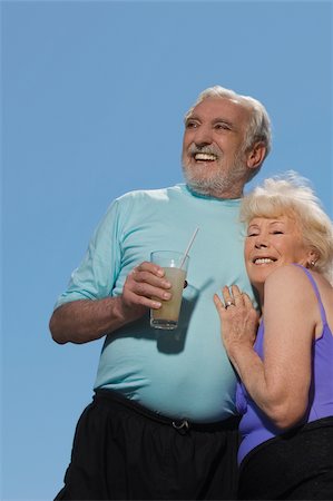 Low angle view of a senior couple embracing each other Stock Photo - Premium Royalty-Free, Code: 625-02931098