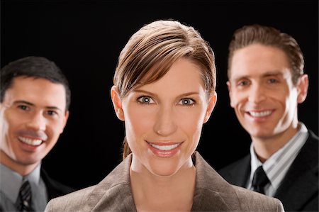 simsearch:625-02931286,k - Portrait of business executives smiling Stock Photo - Premium Royalty-Free, Code: 625-02931290