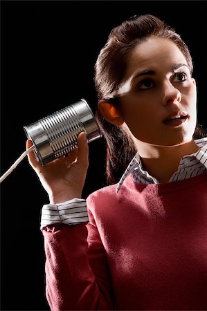 simsearch:625-02932995,k - Businesswoman using tin can phone Stock Photo - Premium Royalty-Free, Code: 625-02931345