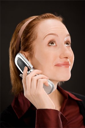 simsearch:625-02931241,k - Close-up of a businesswoman talking on a mobile phone Fotografie stock - Premium Royalty-Free, Codice: 625-02931399