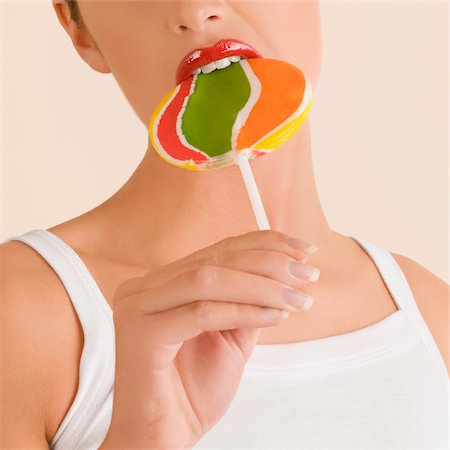 simsearch:649-03292817,k - Young woman eating a lollipop Stock Photo - Premium Royalty-Free, Code: 625-02931446